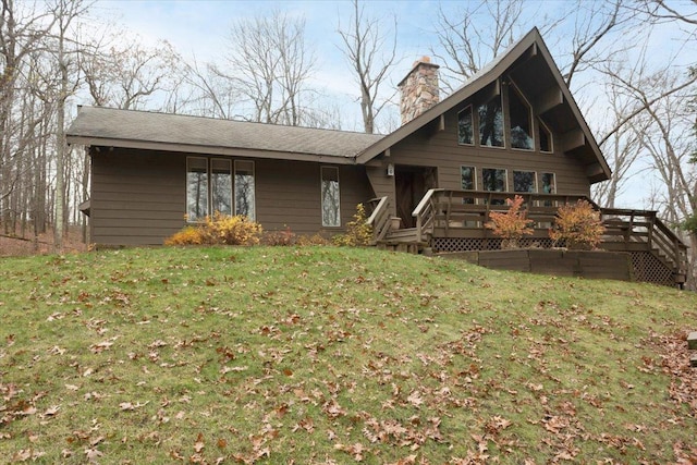 view of front of home featuring a deck and a front lawn