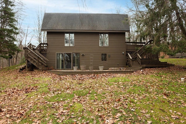 back of house featuring a deck