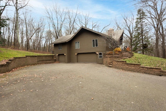 view of property exterior featuring a garage