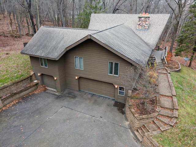 view of side of property with a garage