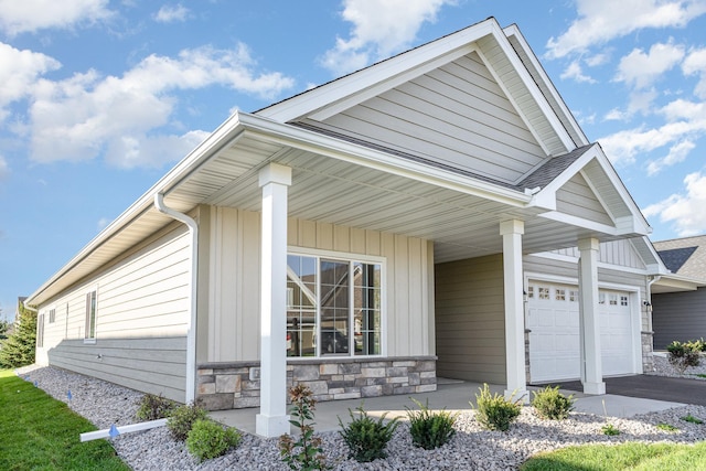 view of front of house featuring covered porch and a garage