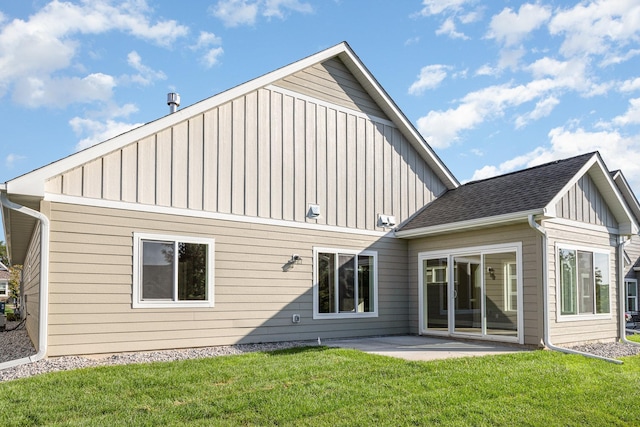 back of property featuring a yard and a patio