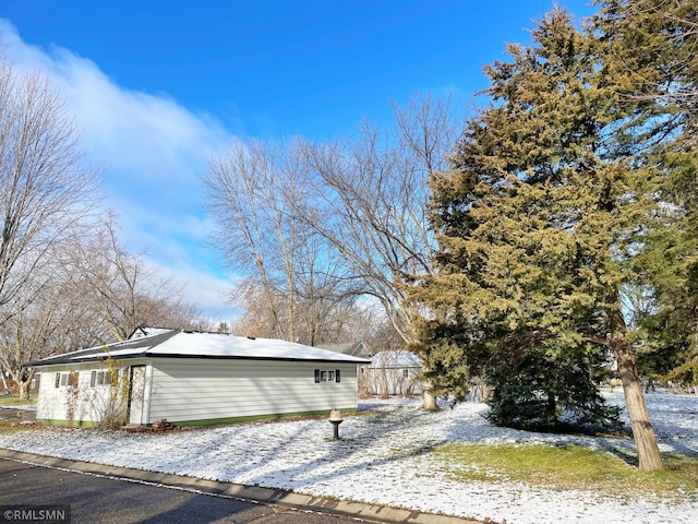 view of snow covered property