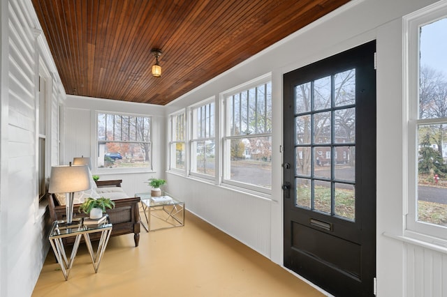 sunroom featuring wood ceiling