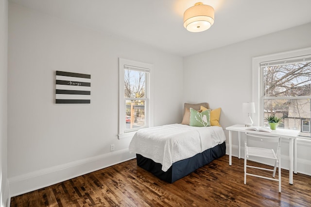 bedroom featuring dark hardwood / wood-style flooring