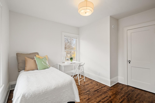 bedroom featuring dark hardwood / wood-style floors