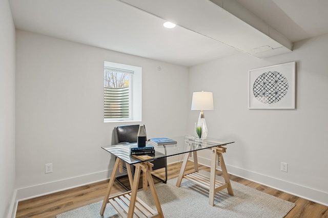 home office with wood-type flooring