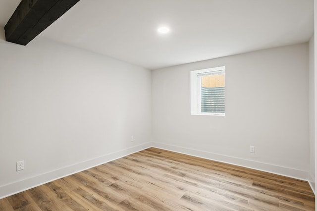 spare room with light hardwood / wood-style flooring