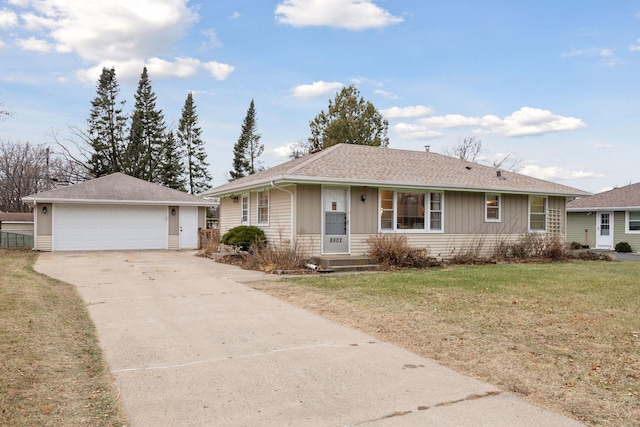 ranch-style house with a front lawn and a garage