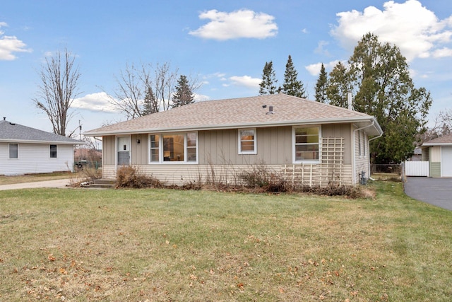 ranch-style home with a front lawn