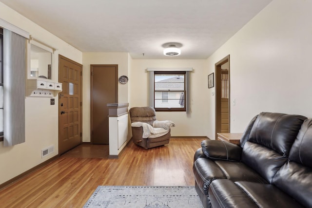 sitting room featuring light hardwood / wood-style floors