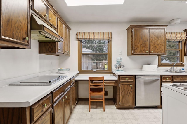 kitchen with dishwasher, cooktop, white range, and sink