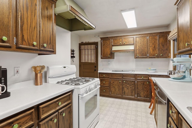 kitchen featuring dishwasher, cooktop, exhaust hood, and gas range gas stove