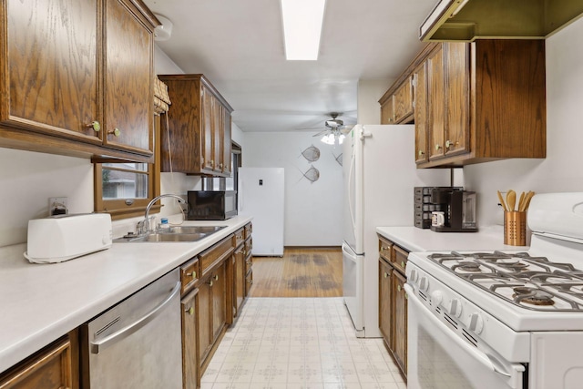 kitchen with dishwasher, ceiling fan, gas range gas stove, and sink