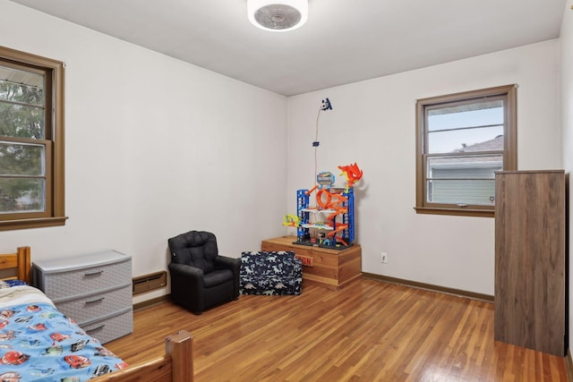 bedroom with light hardwood / wood-style flooring