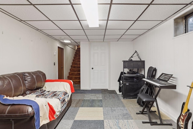 carpeted bedroom featuring a paneled ceiling