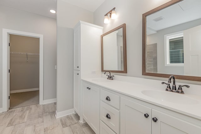 bathroom with vanity and wood-type flooring