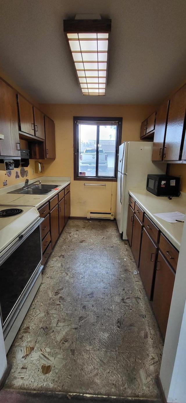 kitchen featuring dark brown cabinets, white electric stove, a baseboard heating unit, and sink