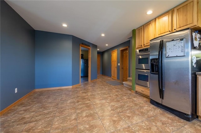 kitchen featuring light brown cabinets and appliances with stainless steel finishes