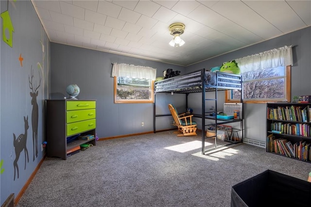 carpeted bedroom with multiple windows