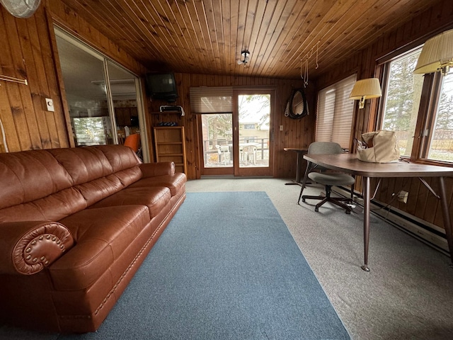 carpeted living room featuring a healthy amount of sunlight, wooden walls, lofted ceiling, and wood ceiling