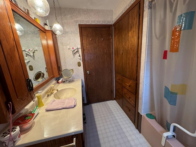 bathroom with vanity and shower / bathtub combination with curtain