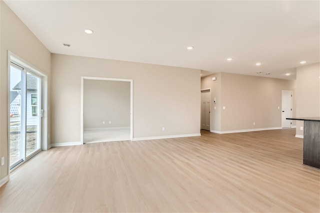 unfurnished living room featuring light wood-type flooring