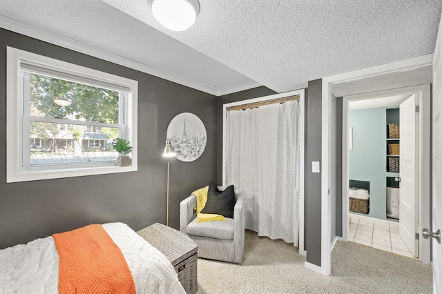 carpeted bedroom with crown molding and a textured ceiling