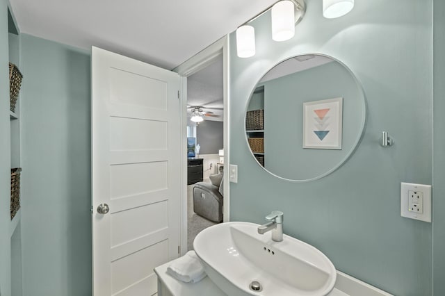 bathroom featuring ceiling fan and sink