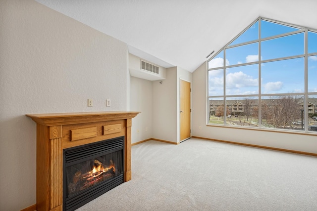 unfurnished living room featuring lofted ceiling and light carpet