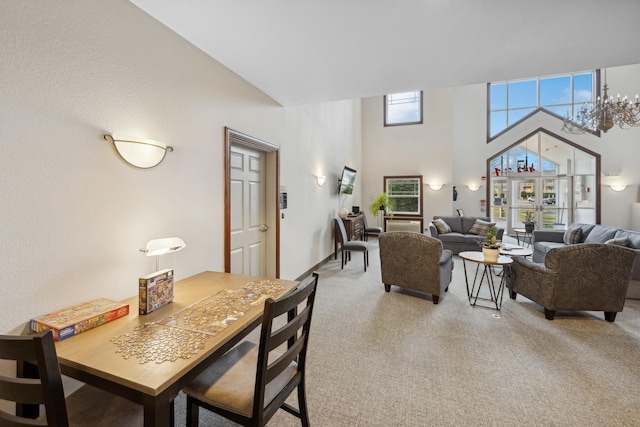 dining space featuring light carpet and a high ceiling