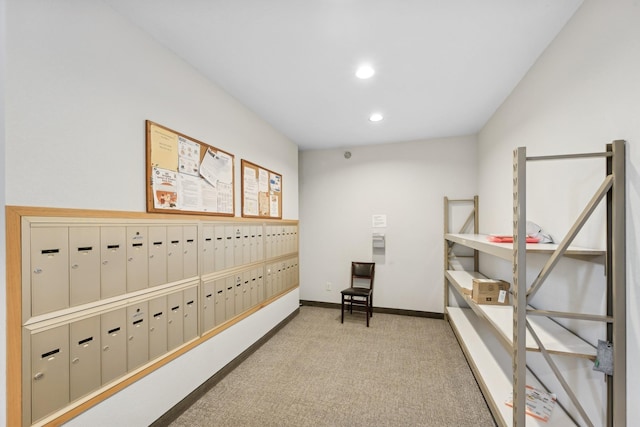 interior space featuring mail boxes and carpet floors