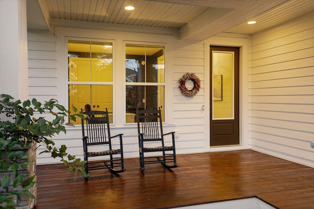 view of exterior entry featuring a porch