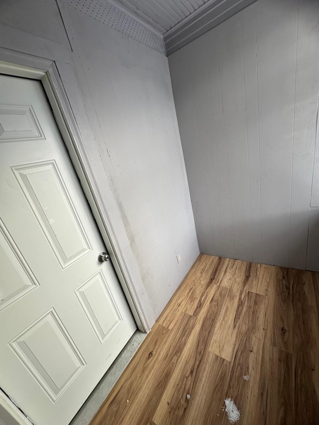 room details with wood walls and wood-type flooring