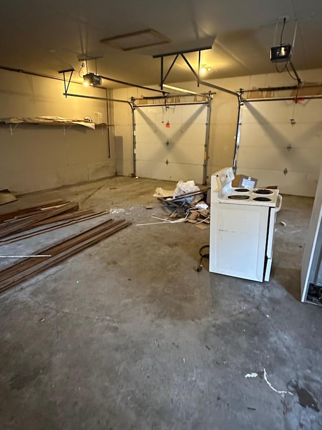 garage featuring washer / clothes dryer and a garage door opener