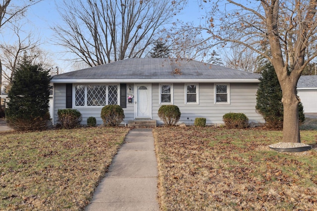 ranch-style house featuring a front lawn