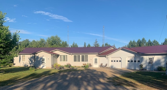 single story home with a front yard and a garage