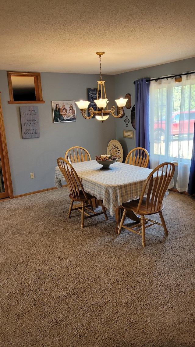 2287 32nd Ave SW, Pine River, MN 56474 - carpeted dining space featuring a chandelier, a textured ceiling, and baseboards