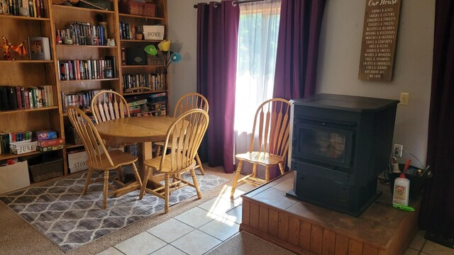 2287 32nd Ave SW, Pine River, MN 56474 - dining space with a wood stove and tile patterned flooring