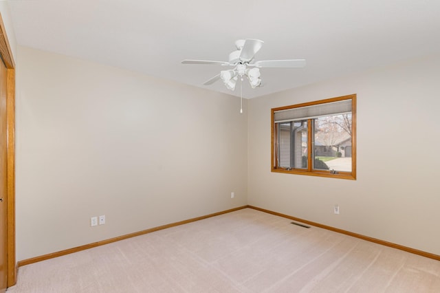 carpeted empty room with ceiling fan