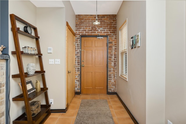 doorway featuring light tile patterned flooring and a healthy amount of sunlight