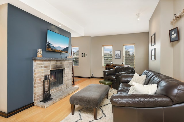 living room featuring light hardwood / wood-style floors and a fireplace