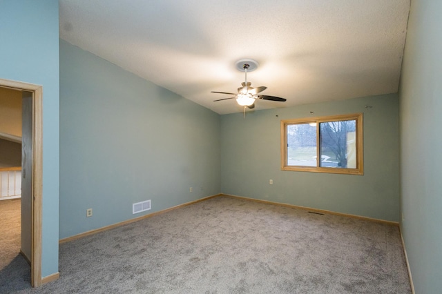 empty room featuring light carpet and ceiling fan