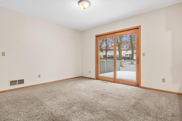 unfurnished room with carpet flooring