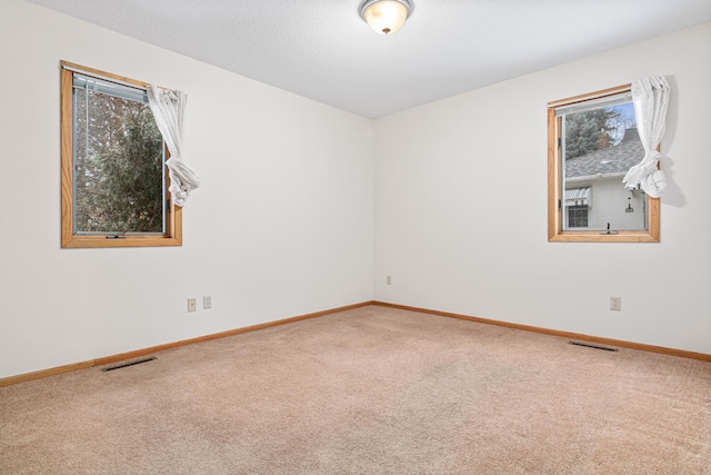 unfurnished room with carpet flooring