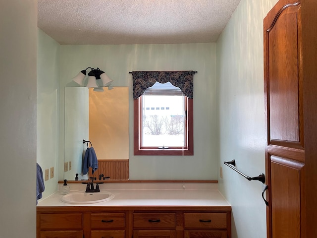 bathroom featuring vanity and a textured ceiling