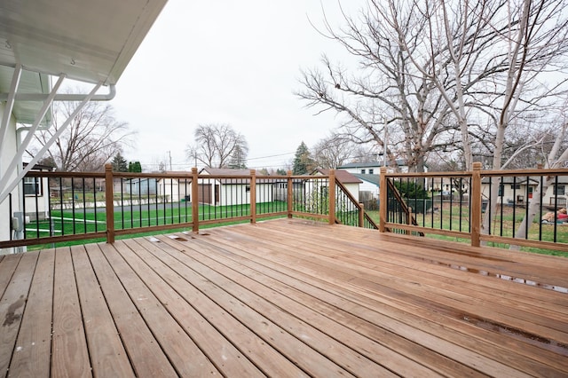 wooden terrace with a lawn