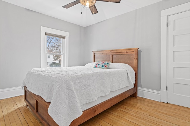 bedroom featuring wood-type flooring and ceiling fan