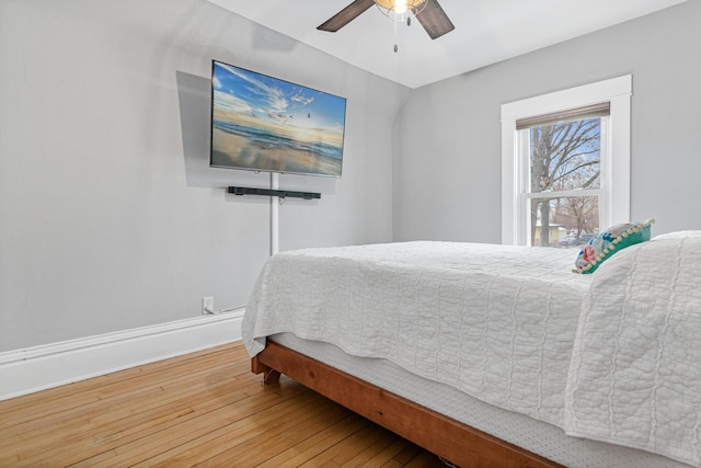 bedroom with wood-type flooring and ceiling fan