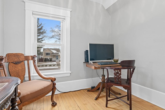 office area with lofted ceiling and hardwood / wood-style floors